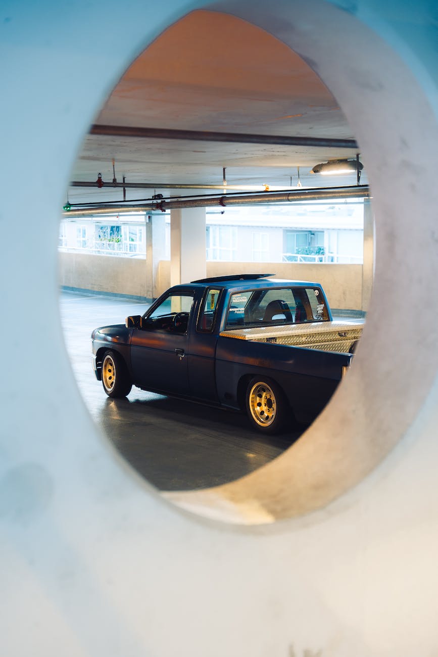 a nissan pick up truck parked in the garage