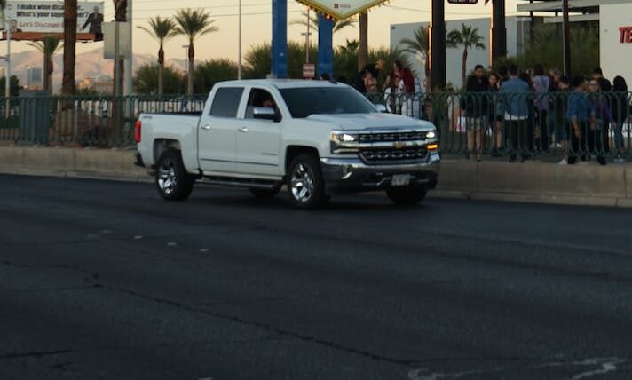 white chevrolet silverado on the road