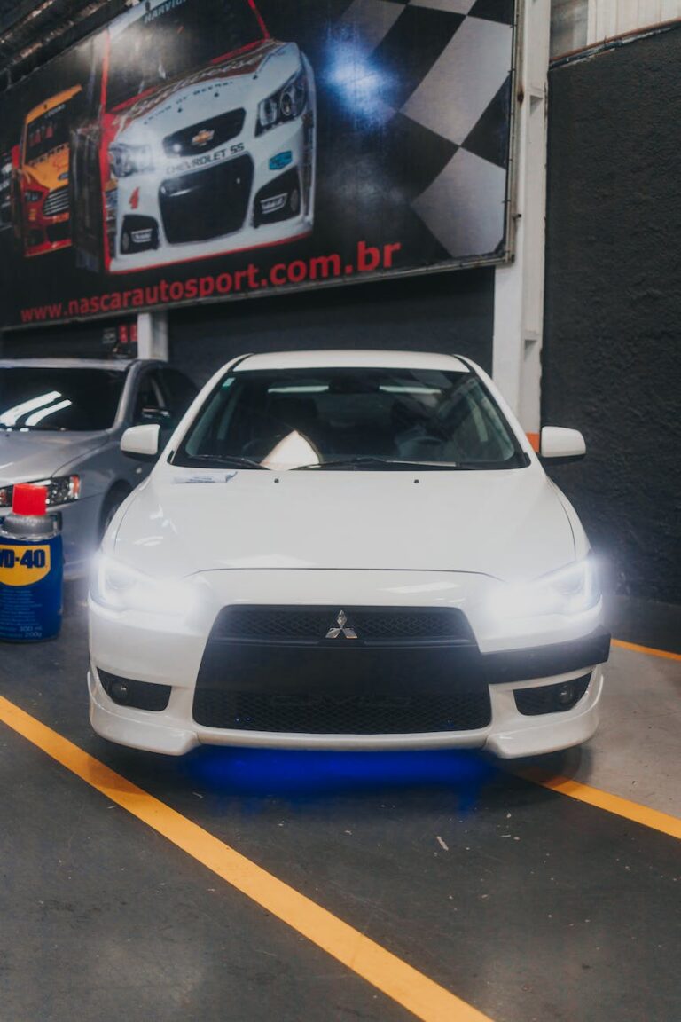 a white car with blue underglow lights